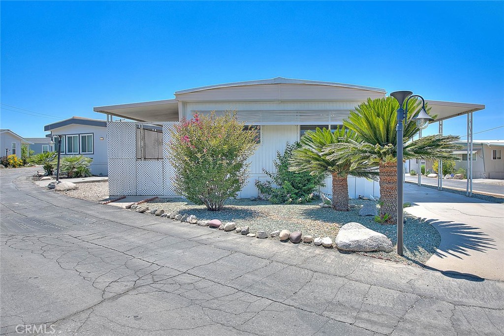 Check out this adorable home in the Las Palomas Estates all age Park with affordable space rent. Home is move in ready and has many upgrades including dual pane windows, newer appliances, newer heater, recently refurbished evaporative cooler and the whole house has updated copper wiring. Both bedrooms have extra large walk-in closets. A huge back yard that is fencible and a full length enclosed patio. Plus covered parking and a storage shed. Las Palomas Estates has a community clubhouse, pool and spa, who could ask for more. Come see it today!