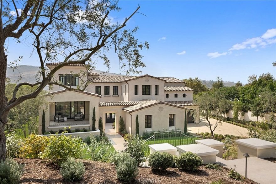 Shady Canyon’s most exquisite new custom home can now be yours. This new construction Santa Barbara-inspired estate offers approximately 8,780 sq ft w/7 bedrooms and 7.5 baths spanning over 25,000 sq ft. The estate is located on one of Shady Canyon’s premier streets, with panoramic views of scenic hillsides and canyons from throughout the home and property. The residence’s soft contemporary interiors create an ambiance of relaxed elegance, with spacious rooms flowing from one to the next and opening through walls of glass doors to the fabulous outdoor spaces, including expansive grounds with large decks, sheltered loggias and an inviting courtyard. Bespoke high-quality finishes and luxe amenities abound, from wide plank white oak flooring to modern linear fireplaces to a spectacular chef’s kitchen with professional-grade appliances, massive island and matching large parson’s table. Other highlights include a sublime master suite with fireplace, private terrace and spa bath, theater with 3-tier seating, wine cellar, casita suite with private entry and on-grade garaging for 4 cars. Shady Canyon amenities include private golf course and country club, hiking and biking trails and award-winning schools.