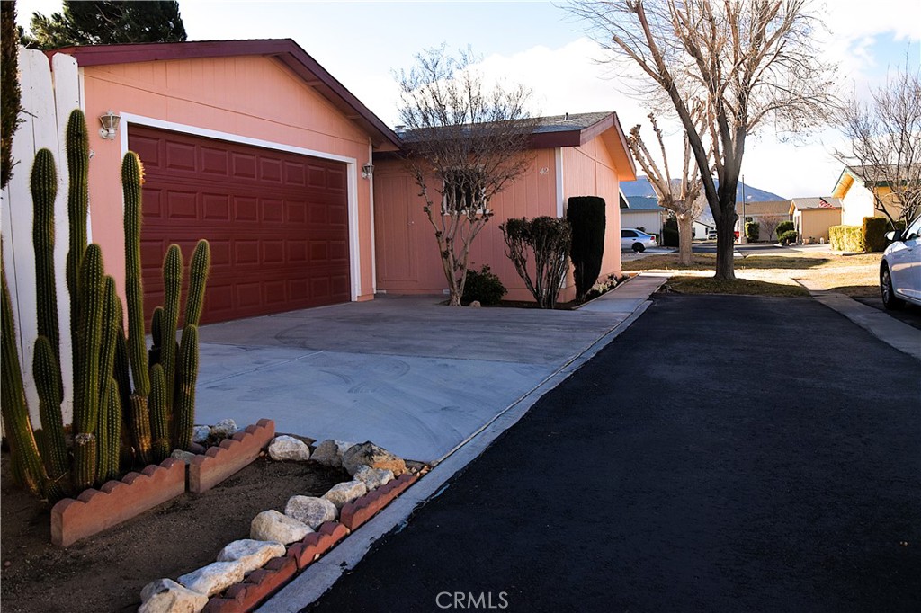 Welcome to 21621 Sandia Rd Apple Valley Ca—this beautiful nice and clean manufactured home is ready for its next owner! This 2-bedroom, 2-bathroom won’t stay on the market for long! Enjoy the spacious 1,248 square feet of interior living,This home also comes with a detached garage for added convenience and a fully fenced-in yard providing ample space for outdoor activities, pets, or gardening, this property offers easy access to club house and pool area amenities Don't miss your chance to own this charming home! Schedule your showing today and make this beautiful home yours before it’s gone! This nice 55+ community is well kept with greenbelts, pool, BBQ area, heated spa, recreation room, exercise room, library, banquet kitchen for gatherings, doggy park, RV parking and shaded areas. This is a gated community & all homes are owner occupied. Easy access to public transportation, shopping, restaurants, theaters & much more.