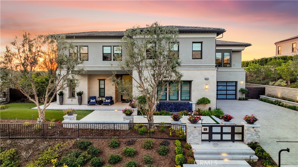 I'm honored & privileged to introduce 4113 Haley Ln- an Unparalleled Gem. This three-year old which looks and feels like a brand new home is a Premiere Offering in Yorba Linda. Discover this stunning jewel gracing a spawning ultra-private, flat premium lot spanning over half an acre and featuring legacy-worthy estate for entertaining on a grand scale with modern amenities. Located in the prestigious Estancia community and built in 2020, this more than "turn-key", luxurious 5 bedrooms & 5.5 baths home w/ a large office & home theater presides on expansive grounds-from custom water fountain in front yard, to resort-like backyard, to an oversized barbecue area and seating around the large-scale fireplace, to gracious waterfalls in nice size saltwater pool and large jacuzzi, fire pit, outdoor kitchen with Alfresco appliances, limestone decking, exquisite landscaping and automatic irrigation system, outdoor infrared sauna, cold plunge tub and separate yoga studio, with a beautiful view of city lights and picturesque golden sunsets. Seller spent two years completing the upgrades and finishing the finest details and spared no expense(w/ $1,400,000 in upgrades & $875,000 in Restoration Hardware furniture package, & more-all with receipts and invoices). Home shows like a model and demonstrates pride of ownership. Noteworthy highlights include custom woodwork , every closet built out by California closet, Restoration Hardware lighting throughout home. Home has 9 Samsung flat TVs; speakers, surround sound and centralized music in every room; home automation system; every door & window wired for security system; solar panels, three Tesla Power lls, 200 amp electrical panel, 50 amp power supply in each garage for future car chargers, twelve high -definition security cameras, Jelly Fish exterior lighting on entire home & auxiliary structures ( holiday lights with 16 million colors & animation), whole- house water filtration system w/ UV filtration & drinking water filtration system. Enjoy Yorba Linda's award winning schools, high ranking safety, and nearby golf course ( Black Gold) as well as central location. This home is a collector's dream who desires only the finest in luxury living. It's truly a rare opportunity to own this extraordinary Yorba Linda treasure. Custom furnishings are available to be purchased.