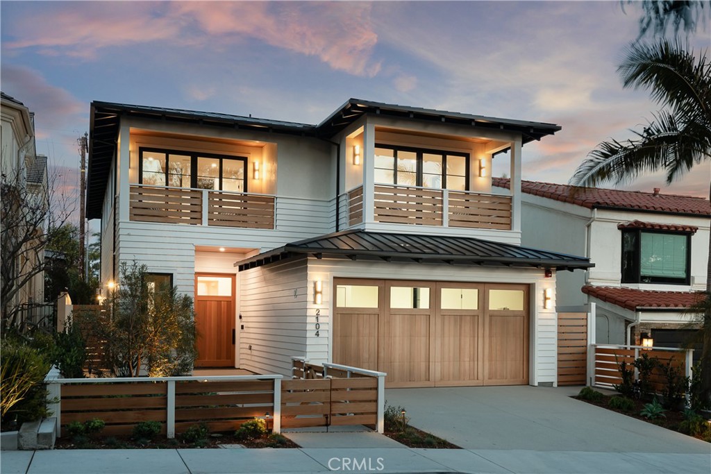 Introducing this 5-bedroom, 5.5-bathroom coastal retreat by renowned architect Douglas Leach sitting in an extremely coveted part of the American Martyrs Tree Section. Completed in 2024, the home boasts 4,863 square feet of low-key glamour, luxury and warmth across 3 airy levels. Connected by a wood-trimmed elevator, discover a tranquil oasis in whites, beiges, and tans. The sunlit foyer welcomes you with an oversized cedar wood door, leading to grand living spaces with 11-foot coffered ceilings and chevron-patterned wood floors. Fleetwood glass doors seamlessly blend indoor and outdoor living, revealing a private backyard with entertaining in mind. Crafted by esteemed developer Talmera Properties this home combines high-gloss aesthetics with warm functionality. The sleek kitchen, adjacent to the living room, features designer cabinetry and a central island. The lower basement level offers another everyday living area, full bar, glass framed wine cellar, an en-suite bedroom, a fitness studio, and a walk-in steam shower. The serene primary suite exudes spa-like luxury with floating vanities, a soaking tub, and a separate beverage center. The home is the perfect blend of family comfort, elevated entertaining spaces with a timeless yet thoughtful design. Featuring an extensive list of high-end amenities and upgrades of superior quality, this home is A MUST SEE!