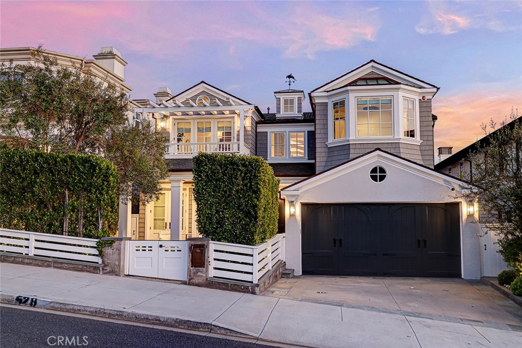 Welcome to 528 15th St. One of the highest quality family homes in the American Martyrs area of the Tree Section. Offering size, location, ocean views, custom craftsmanship and an overall total package rarely available to the public. Boasting 6 bedrooms, 7 baths plus an office and 6241SF (BTV) of living space, this estate home has the timeless 'Traditional' style that lasts a lifetime. Beautifully reimagined by RJ Smith Construction, amenities include Zoned AC with multiple mini split systems, wide plank Oak flooring throughout, a three stop elevator, three fireplaces, a very unique and rare double island kitchen with marble countertops, living Brass plumbing fixtures, high-end lacquered kitchen cabinets, top of the line Sub Zero and Wolf appliances and a built-in Miele espresso machine. An oversized breakfast nook fits all the children for those intimate breakfasts and dinners. Behind the kitchen is a thoughtful formal dining room with a guest bedroom, ensuite bath and the office. Continuing in the family room are vaulted ceilings, plenty of natural light and steel doors leading out to a south facing deck with fireplace and Sunbright TV above, built-in Wolf BBQ with Penn. Bluestone countertops and stainless storage drawers. Ocean views peer over the mature ficus trees.
Entry level offers four bedrooms, including the laundry room. The master suite is spacious with automatic shades, custom wallpaper, a walk-in bathroom with oversized shower, marble counters and stand alone soaking tub and custom cabinetry in the closet. Adjacent are two more bedrooms with a Jack and Jill bathroom. Leading out to the yard you will find a clean blend of greenery, including mature ficus trees, artificial turf and planting done by Rob Jones Landscaping.
The basement is a great setup for families with a state-of-the-art home theater with stadium seating and a 142" Stewart Film-screen, a NYC Soho inspired home gym with sliding Fleetwood doors, a generous size bar with sitting area and a customized steam room, along with a guest bedroom, en suite bath and another powder bath for guests. The whole series runs on the Savant home automation system, with Lutron shades and Vantage lighting control, easily accessible at the touch of your finger.
Down the street from the one of the most sought after schools in Manhattan Beach, American Martyrs, within a very short walk to downtown's award winning shops and restaurants, a world class beach and Live Oak and Dorsey Park.