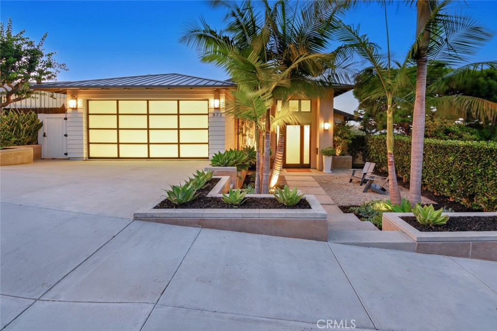 Major price reduction on this beautiful and current transitional Hill Section home.
Spacious modern transitional 5,088 square foot home is in the desirable HILL SECTION of MANHATTAN BEACH. The home is "current" in design and "timeless" in style to capture tomorrow's desires today. The featured areas in this open and flowing floor plan are well-designed and spacious. There are TALL CEILINGS throughout. The open floor plan allows a main common living floor that flows easily upon entering the home, through the home, and to the outdoors again. The family sleeping area is accompanied by a family media room or play area (for the young or younger) and is ideally located adjacent to the family living area of the home, which is just one floor away. Direct access to the pool, spa, and outdoor living area can be easily accessed from this level.
The OUTDOOR space offers optimum PRIVACY, which is sought after and hard to find. The COVERED PATIO offers seating, a television, and a featured fire ring designed with additional built-in seating. The CITY VIEW DECK, with direct access from the kitchen and family room, offers a built-in BBQ and serving center, as well as space for additional seating and dining. This area has direct access to the SALT WATER pool, which features a waterfall at one end and a built-in spa at the other. In addition, the design is highlighted by the well-placed pool seating platform, which is large enough for two reclining loungers, an umbrella, and a side table. The PRIMARY SUITE features a double-door entry into a foyer adjacent to the suite, a walk-in closet, a bath retreat room with dual sinks, a freestanding tub, and a separate shower. The suite's bedroom is highlighted with floor-to-ceiling glass pocket doors and oversized windows for easy outdoor access and viewing enjoyment. The MEDIA/FAMILY PLAY ROOM is large and offers flexibility in its use. All the bedrooms are well-sized and have spacious closets. EXTERNAL AMENITIES include the calming Manhattan Beach wind, "BEACH BREEZE," and a breathtaking LA CITY VIEW highlighted by the beautiful San Gabriel Mountains. Noteworthy: Downtown "TOWN" Manhattan Beach or the ocean/walkway "THE STRAND" is just a quick walk away!