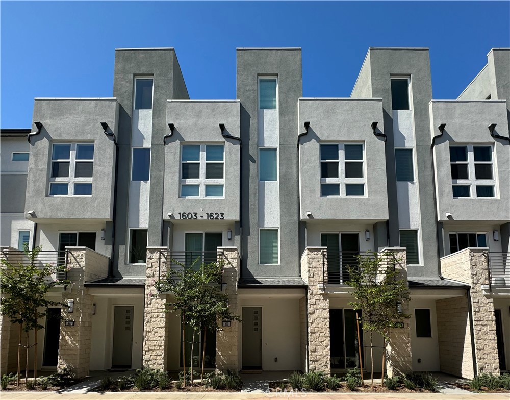 Toll Brothers brand new GATED community at 100 West in Anaheim. Really contemporary elevation and house layout. The first floor features a bedroom and a full bathroom, the hall way connected the spacious two car garage. Go up stairs to the spacious great room, dining area, and desirable covered balcony with a lot natural light. The upgraded kitchen is highlighted by a center island with breakfast bar, plenty of counter and cabinet space, and sizable pantry. Go up to the third floor, there is the master bedroom and another guest bedroom with private bathroom. This unit has an open deck at the fourth floor and with good view of Disneyland's fireworks. 100 West community is centrally located in the heart of Orange County minutes to major entertainment & shopping centers such as Disneyland, Honda Center, Angel Stadium Walk. Easy & convenient access to excellent medical centers, college campuses, major freeways & transportation hubs. The community swimming pool is closed the this unit. Solar panels installed and paid off to help reduce electric bills.