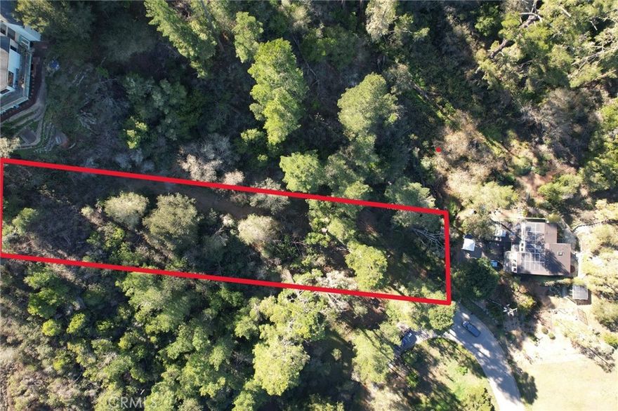 Vacant lot that backs up to ranch land. Dimensions are approximately 50 X 287 with 14,450+- square feet. There is no water meter associated with this lot. Drive by, and see it for yourself. Call your local realtor with any questions!