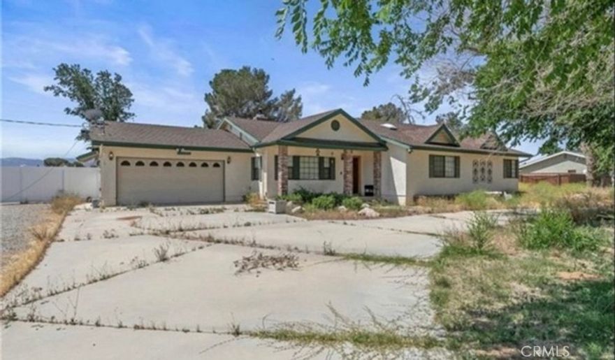 Welcome to this stunning custom-built westside home in the serene White Fence Farms neighborhood! Situated on 2.6 acres, this spacious 3,200 sq. ft. property features 4 bedrooms, 2 bathrooms, and an office, making it perfect for all your needs. Enjoy breathtaking views in a quiet, peaceful setting while being conveniently close to freeways and shopping.



The unique ranch-style floor plan offers comfort and functionality, highlighted by a large country kitchen with custom cabinets. The oversized master suite includes a walk-in closet with a skylight, built-in cabinets, and shelves for ample storage.



Additional features include a circular driveway, natural gas, central air with master cool, mature landscaping, and incredible closet space throughout. Don’t miss out on this one-of-a-kind property—schedule your showing today!