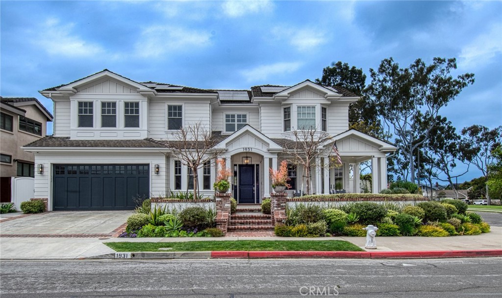 Nestled within the Port Streets community of Newport Beach, 1931 Port Locksleigh stands as a testament to timeless elegance and contemporary luxury. Crafted by RDM Construction this striking custom home boasts 6 bedrooms, 5.5 bathrooms, and a rare basement retreat. Designed for seamless indoor/outdoor living, it offers an unparalleled setting. Ideally situated in the inner loop, directly across from the greenbelt and in close proximity to the park, clubhouse, pool and Andersen Elementary.
Recently refreshed by Brooke Wagner Design, this home offers an idyllic haven for relaxation and entertainment. The main level welcomes you with an impressive chef's kitchen featuring high end appliances, quartz countertops, a walk in pantry and a grand center island that flows effortlessly into the great room adorned with a fireplace. Retractable sliding doors lead to an entertainer's paradise outside, with a covered patio featuring a TV, heaters, saltwater pool and spa, built in BBQ and fire pit amidst lush landscaping. The main level also includes a private dining room that opens to the cozy front porch, an office with ample built-ins, laundry room, mud room, powder bath and a ensuite bedroom, perfect for your guests.
Ascend to the second level to discover the luxurious primary retreat, offering serene views of the green belt and plenty of natural light, a lavish bathroom featuring his and her sinks, a stand alone soaking tub, a walk-in steam shower all enveloped in neutral-tone marble, and a custom walk in closet. The kid's wing offers four bedrooms centered around a study lounge with two full bathrooms.
A unique highlight of this home is the basement, providing a haven for entertainment and relaxation. Enjoy the grand theatre area for movies and family time, while the adjacent space offers room to work out or play pool and also has a full bathroom.
Experience modern living with recent updates, including, solar panels, Tesla power wall, a dog washing station, advanced water filtration systems, refinished hardwood floors, new carpeting in bedrooms, new garage door, updated landscaping, updated pool surfaces and retractable pool cover. Enjoy the Newport lifestyle with easy access to Fashion Island, World Class Beaches, John Wayne airport and top Restaurants. With its impeccable design and thoughtful amenities this exceptional residence offers a lifestyle of comfort, sophistication and convenience.