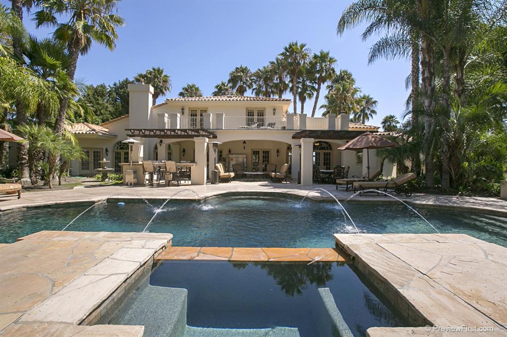Elegantly designed Estate and Entertainers Delight, sited on 1.2-acres of beautifully landscaped grounds, offering 4 bedrooms, 3 full baths plus 2 powder rooms, an office, a loft, an entry level master suite, and a gorgeous backyard boasting a pool & spa with water features, built-in BBQ, bar and with plenty of room for a tennis court or guest house. Conveniently located in the gated community of Rancho Diegueno Estates. Situated in a tranquil, rural setting within the gated community of Rancho Diegueno Estates, this elegantly designed residence rests on a 1.2-acre parcel surrounded by beautiful, mature landscaping. The impeccable interior includes 4 bedrooms, 3 full baths plus 2 powder rooms, an office, a large loft area, travertine & wood flooring, and a dramatic 2-story formal living room. The gorgeous cook's kitchen provides granite slab countertops and island, stainless steel appliances, a walk-in pantry, as well as a breakfast area. The adjacent family room, with its beamed ceiling, rustic stone fireplace and wet bar, is the heart of the home and offers 2 sets of French doors leading to the backyard. The master suite, privately sited on the entry level, boasts his and hers walk-in closets and a sumptuous stone bath with dual vanities, a soaking tub and separate oversized shower. The upper level houses 3 bedrooms, 2 baths plus a loft area, which is a perfect office, playroom or study station. The breathtaking backyard is your own private paradise featuring lush, tropical landscaping, an expansive lawn area, a sparkling pool & elevated spa with soothing water features, a fire pit, and an outdoor grilling station with a large bar. Other amenities include: zoned central forced heating & air conditioning, indoor/outdoor surround sound system, security system, and more.. Neighborhoods: Rancho Diegueno Estates Equipment: Garage Door Opener,Pool/Spa/Equipment, Range/Oven, Water Filtration Other Fees: 0 Sewer: Sewer Connected Topography: LL