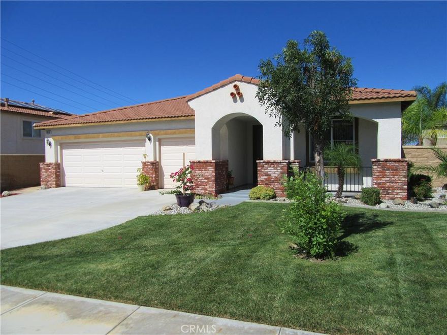 Better hurry on this beautiful single story home, with low property taxes, in a newer community of Menifee.  A hard to find single story home with a 3 car garage.  The moment you walk up to the stunning leaded glass front door, you will know this one is special!  This home is sparkling clean and truly move-in condition .  You will love the neutral tile floors that extend from entry to halls, family room, kitchen, baths and laundry room.  The floor plan is very open and practical with 4 bedroom sand 3 full baths.  Kitchen is open to family room and offers a large center island with sit-up bar and sunny nook area.  Family room is spacious and includes a fireplace.  Master Suite is good size and offers large walk in closet,  glass surround shower and deep soaking tub.  The laundry room is huge!  Garage has epoxy floors.  It only gets better as you enter the beautifully landscaped backyard with large patio with alluma-wood cover.