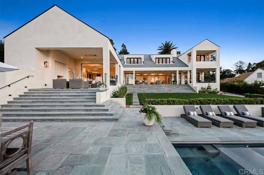 Exquisitely built with precision and perfection in every way, blending relaxed coastal design and high-quality finishes with unobstructed ocean views! Enjoy floor-to-ceiling Fleetwood pocket doors that open to 1000 SF of covered patios, French Oak floors, high coffered ceilings, and all the natural light these details offer. Featuring a master retreat, gourmet kitchen/great room with butlers pantry, 2 staircases, a mud room, 2 laundry rooms, 2 offices, and a loggia with fireplace, TV & outdoor heaters! [Supplement]: 5 En-Suite BRs (Master Retreat + 3BR Upstairs, 1 Guest En-Suite down, +1 Pool Bath with Outdoor Shower, +1 Half-BA Powder Room) * Santa Barbara Smooth Stucco Exterior * French Oak Floors Throughout * Pennsylvania Blue Stone Patios & Entrance * Recessed Lighting Throughout * Fleetwood Multi-Slide Pocket Doors & Windows in Foyer, Living Room and Kitchen/Family Room (Marvin windows/door throughout the Rest of House) * DaVinci EcoSlate Cool Roof (meets Title 24 Requirements for CA ENERGY STAR qualification) * Hunter Douglas Motorized Blinds in Kitchen, Living Room, and Downstairs Office/Study * Nest Thermostats * Sonos Music System - Speakers in Master Bedroom and Bath, Downstairs Office, Living Room, Kitchen/Family Room & Outdoor TV Pavillion * Arlo Wirless Cameras & ADT Security System (Both systems can be controlled by phone/ipad) * SkyBell Front door - Can communicate with visitors through phone/ipad * 2 Tankless Water Heaters * 2 Laundry Rooms (each with Whirlpool Duet Washer/Dryer) * Built-in Ironing Board in Upstairs Laundry Room * HousePure ScaleStop Whole House Water Filtration System * 3-Car Attached Garage with Electric Car Charger * Gourmet Kitchen Features Calacatta Caldia White Marble Countertops * 3 Kitchen Sinks with Dornbracht Faucets (Full-Size Island Sink, Full-Size Counter Sink, Butler's Pantry Sink) * Subzero 36" Integrated Column Refrigerator with Internal Water Dispenser * Subzero 36" Integrated Column Freezer with Ice Maker * Subze...