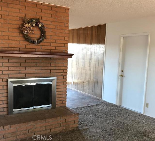Just completed return to 2 car garage and removed two enclosed patios. Three bedroom 1 3/4 bath Apple Valley home. Living room has a fireplace with raised hearth. Dining area off kitchen. Recently painted interior and exterior. Roof & Septic tank new in 2012.