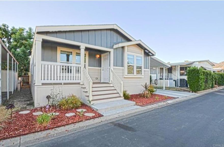 This beautiful 2018 manufactured home is located in an all-age park that has been very well maintained. This home is equipped with Solar for energy efficiency. 3 bed/2 bath with vaulted ceilings, crown molding, and an open floor plan with lots of windows and stainless-steel appliances, center island with pendant lighting, walk-in closet, dual sinks in the master bathroom. Large garden tub with a separate shower. This home has a very nice front porch that has plenty of room for entertaining guests. Parking for 3 cars. This home is ready for you to move in and enjoy. Here's your chance to own a beautiful home at a great price in Escondido. Make an appointment today! Buyer and Buyer's agent to verify ALL.