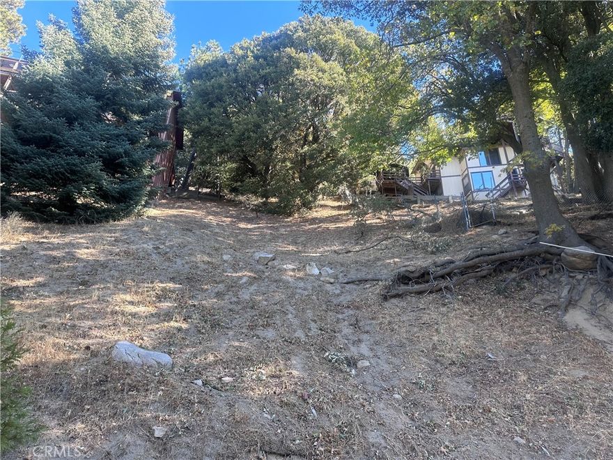 Have you dreamed about having your vacation home at a mountain? Then come and see this great lot in the city of Crestline CA. With only a few minutes from the lake, this lot is in a great location and quiet neighborhood. Water and electricity nearby. This lot is between two established homes.