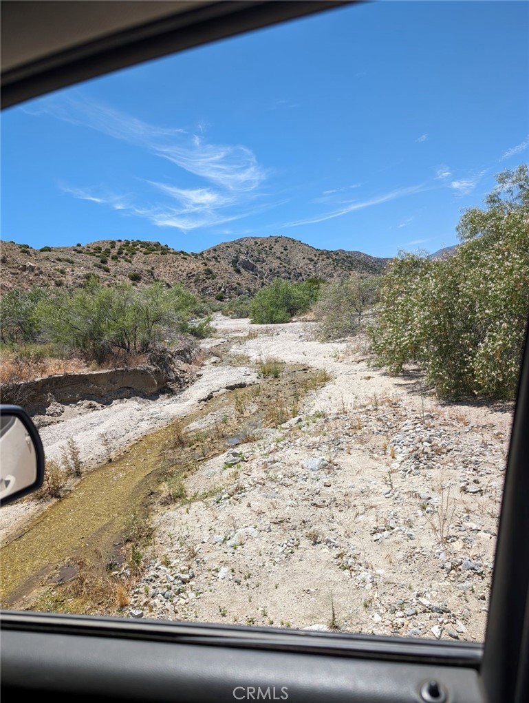 Water in the desert! Welcome to 49170 Via Hacienda That's right this property has a seasonal creek that runs across the property for several months out of the year, abundant wildlife and pristine desert environment make up these 5 acres a true desert gem. Not many properties like this in the desert!! The road is dirt and a bit long but well worth the drive great views and in a nice, secluded area near the top of big Morongo canyon road. Turn this property into something special! Power pole near or on property corner, no water on property well area. Buyer to due diligence to satisfy with allowed use of land. Lots of possibilities. Owner may carry. Terms negotiable. Realtor is property owner.