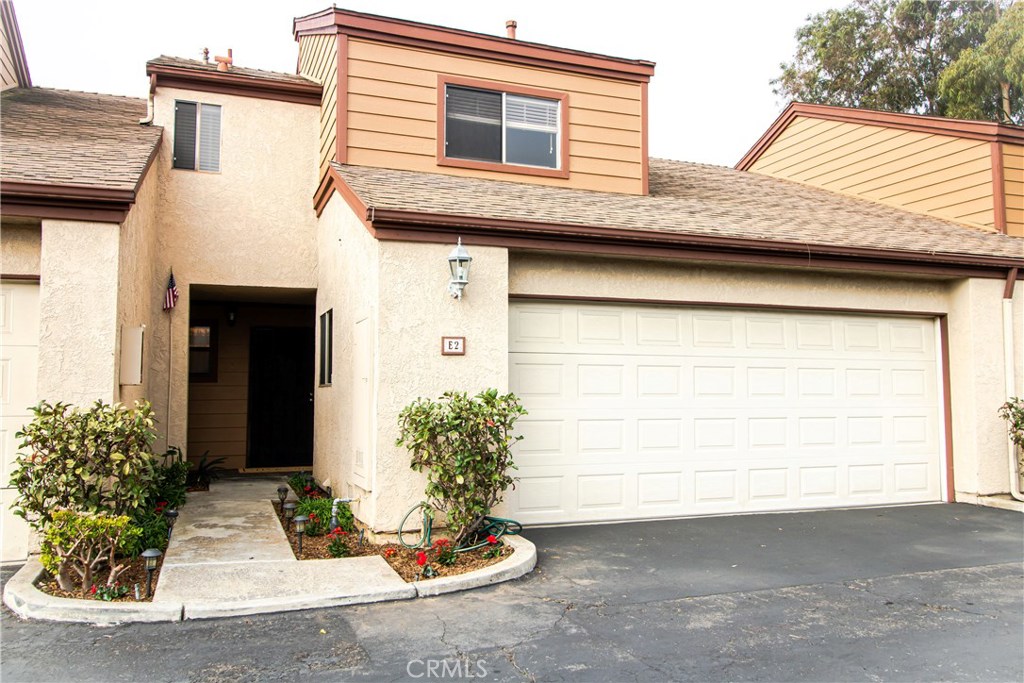 This Townhome is move in ready! Enter into the inviting family room with vaulted ceilings featuring a cozy fireplace and a sliding glass door to a spacious and private covered patio. Perfect for outdoor dining year round. The kitchen has solid wood cabinets and title floor's. Going upstairs, you are greeted by a perfect spot for a home office or kids room. The master bedroom features an oversized closet and an en-suite master bathroom. The generously sized secondary bedroom features a large closet and is adjacent to the spacious bathroom. This home has it all including, lighting throughout, ceilings fans & above the staircase radiating natural light throughout the home. There is also direct access to the two car garage. Close to shopping centers and local beaches.