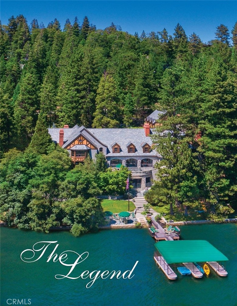 Waterfront Estate! Situated on 3 glorious Lakefront Lots of lush Forest, Lawns and Gardens, the Magnificent English Estate is totally private. Impeccably designed, while stately, a sense of warmth and comfort penetrates the Grandeur. The English Pub is huge, with Wet Bar, Pool Table, Ping Pong Table and custom tempered Wine Tasting Room. The Pub opens to a spectacular outdoor entertaining Pavilion overlooking the Lake. No expense was spared in the construction and design, and there is a gorgeous Waterfall as you wind down the Private Drive. 6 Bedroom Suites, all with Fireplaces. Grand Master, Gentleman's Library and Gallery on the Upper Wing. Presidential Formal Dining Room with Fireplace off the Rotunda and Loggia. Music Room is sculptured to perfection. Explosive Lake Views! Separate Staff Quarters. 2 Levels of Garage parking for Boats or Limos. Elevator. Double Canopied Dock with 2nd Double Dock Rite. Waterfront!