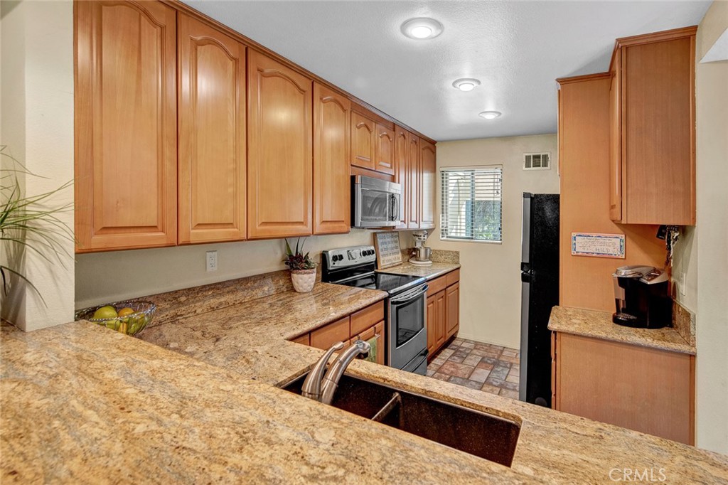 Located in the Villeurbanne Community of Orange, 5744 E Creekside Ave #4 is a Move-In-Ready Townhome Showcasing Two Bedrooms, Two Bathrooms (One Bedroom and Bathroom Located on the Main Floor), and Ample Natural Light Throughout. The Dining Room Features High Ceilings, Skylights, and Opens to the Family Room. The Kitchen Has Granite Counters, Ample Cabinet/Counter Space, Stainless Steel Appliances, Bar Seating, and Overlooks the Family Room Which is Perfect for Entertaining. The Spacious Family Room Showcases a Cozy Fireplace and Access to a Fully Private Balcony. The Master Bedroom Boasts Ample Closet Space and Beautiful Nature Views. The Villeurbanne HOA Includes a Resort Style Pool, Spa, Club House, Creeks, Trash, and Water. Short Drive to Irvine and Peters Canyon Regional Parks, Shopping, and Dining. Easy Access to the 55/22/91 Freeways and 241/261 Toll Roads. 5744 E Creekside Ave #4 is a Must See!