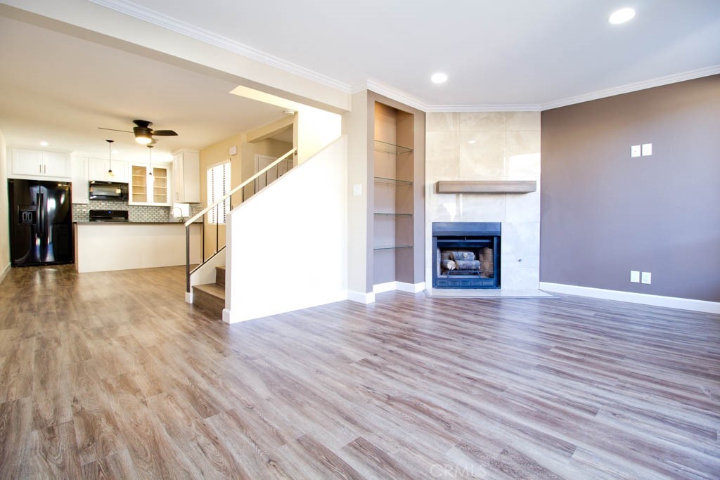 Wow! Wow! Wow! Absolutely Gorgeous Fully Remodeled 2 Story End Unit with Private Patio & 2 Car Garage, Central Air/Heat, New Kitchen with Granite Countertops and New Appliances, New Bathrooms with Granite Countertops, New Flooring, New Lighting Thru out, 1/2 Bath Downstairs,Large Master Bedroom and guest bedroom Bedroom upstairs have Vaulted Ceilings,guest bedroom has a balcony .Livingroom with Gas Fireplace, New Mantle, New Interior Paint, Indoor Laundry Upstairs, Private Patio Area off Living Room with BBQ Island w/ granite counter and Refrigerator, 2 Car Detached Garage with Epoxy Coated Floor and garage door opener, Drywalled and Garage Door Opener, Condo has very few steps to into home and a level entry (Best access in community), Just a GREAT Condo... Community has Pool & Spa, Close to All that La Habra Offers, Shopping, Entertainment Areas, Dining, and so Much More...