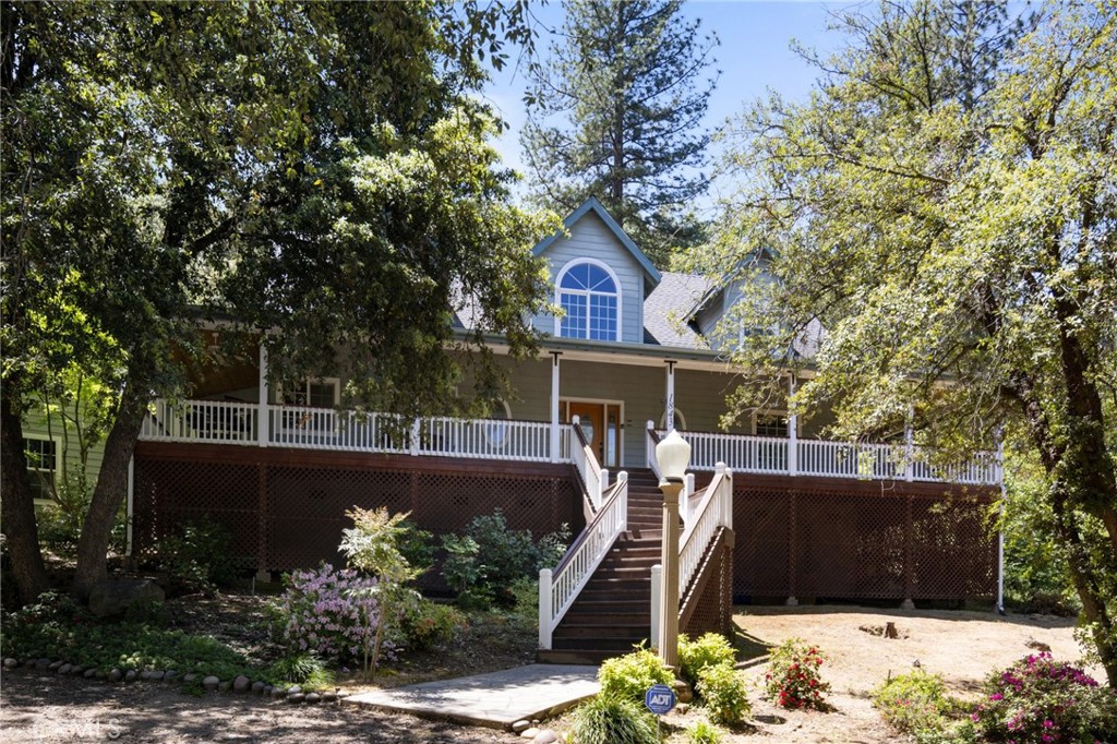 This is an incredible property! Its location between Mariposa and Oakhurst offers easy access to Yosemite National Park, making it a prime spot for short term rentals. The amenities like the custom in-ground pool with a waterfall and the outdoor kitchen/dining area make it perfect for entertaining guests. The home itself seems to have been designed with both luxury and functionality in mind, with features like the Master Suite on the Main Floor, the chef's kitchen with a walk-in pantry and wine fridge, and the spacious living room with dramatic ceilings. The additional bedrooms, office space, and bonus room above the garage offer plenty of room for guests and activities. And with amenities like the Generac Generator, water storage tank, and outdoor tub/shower, it's clear that attention has been paid to both comfort and convenience. Short term Rental opportunity with potential for an additional Future 1440+/- sqft barn dominium to build out. This home is 3 beds/3 baths w/2,523+/- sf with the Master Suite on the Main Floor, wrap-around decks knotty pine ceilings that overlook your custom in-ground pool w/waterfall on 5.25+/- Acres. The entry has pebble tech flooring to the spacious living room w/dramatic 30'+/- ceilings with access to your outdoor kitchen/dining area & pool. There is plenty of room for family & friends in your indoor formal dining area. The chef's kitchen has everything you need with a walk-in pantry & wine fridge w/serving area. The 2nd floor overlooks the main floor with 2 additional bedrooms, an office/desk area, and plenty of storage for winter crafting & more. The Finished Bonus Room above the attached garage is a perfect game room, crafting room or you decide. The Laundry area provides plenty of extra storage & cabinetry for guests. With the additional outbuildings, the Sky's the limit for creating a family compound. Generac Generator, 2500-Gal water storage tank, additional water heater for the detached buildings w/bath and there is even an outdoor tub/shower in the garden area. Call today to visit this truly amazing property!
