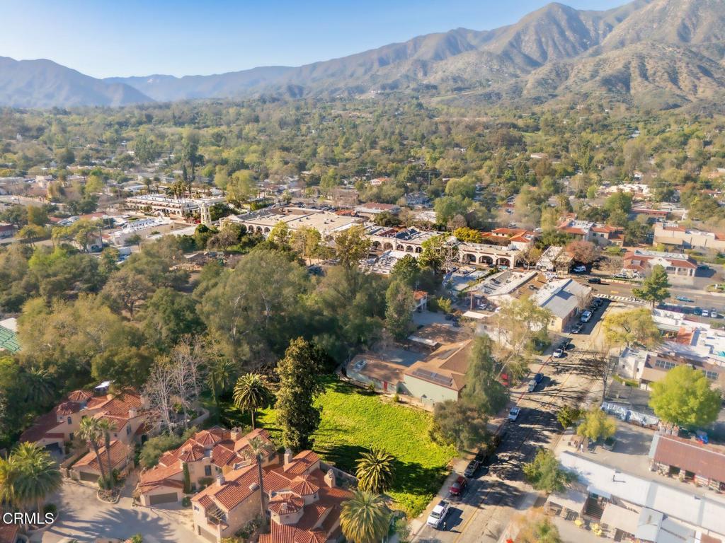 This is a unique opportunity in the heart of downtown Ojai. One of only a few undeveloped lots in downtown Ojai, this offering presents a rare opportunity to design with intention in a place that values both artistry and community. Build your dream home, or commercial-residential space on this half-acre (21,780 sf) commercial-residential parcel. Located just off the iconic Libbey Park, with public access adjacent to the lot, 201 South Montgomery Street offers a blank canvas for a thoughtfully designed development in one of Ojai's most connected and creative neighborhoods. The rear of the lot is bordered by a seasonal creek and pedestrian bridge surrounded by trees, with access to Libbey Park. Walk to all of your favorite spots downtown or relax in the homestead you've been envisioning for yourself all these years.
