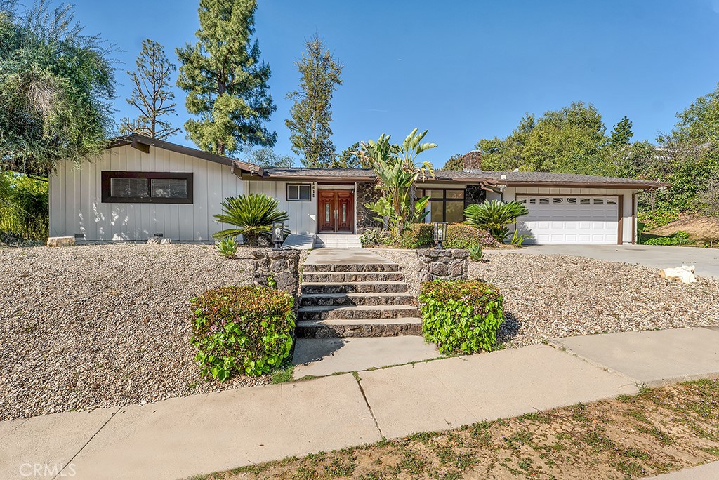 Nestled in the highly sought-after neighborhood of Tarzana, this stunning single-story home offers a perfect blend of tranquility and convenience. Located south of the boulevard and within the desirable Wilbur Avenue Elementary School district, this 3-bedroom, 3-bathroom residence spans an impressive 2,160 square feet of thoughtfully designed living space. Step inside to discover a bright and inviting interior adorned with elegant finishes, including hardwood floors, crown molding, and recessed lighting. The spacious living room is ideal for entertaining or relaxing with family and friends. The updated kitchen boasts stainless steel appliances, ample cabinetry, and a cozy breakfast nook, making it a chef’s delight. Each bedroom is generously sized, filled with natural light, and designed for maximum comfort, while the freshly painted walls add a touch of modern charm. Outside, the property transforms into a private oasis. The property sits on almost 12,000 sqft of lot and features a sparkling pool, lush lawn, and a covered patio, perfect for outdoor gatherings, barbecues, or enjoying Southern California’s sunshine. Conveniently located near trendy shops, top-rated restaurants, and vibrant entertainment options, this home perfectly balances peaceful living with urban accessibility. Don’t miss this rare opportunity to own a piece of Tarzana’s finest real estate.