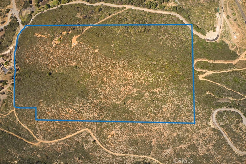 Panoramic Ocean, Snow Capped Mountain, City Lights and Valley Views surround this 25.93 +/- acre prime development site. Potential for one to four large premium lots, buyer to confirm. The sale includes two parcels (222-180-07-01, 222-121-06-02) sold together and is located adjacent to the desired San Elijo Hills Community. Endless possibilities - Build your Dream Home and sell off the remaining parcels to cover your costs. Abundance of privacy, open space, and grandeur. Private gate on black top road leads to this location, neighborhood consists of several custom homes and this huge parcel is the apex of the neighborhood with some of the best views around. Electric & Water available, paved & gated road leading to property behind Double Peak School in addition to the access through the main gate. Close proximity to Cal State San Marcos University, Schools, Palomar Hospital, Coaster Station, Freeway, Shopping Centers & Restaurants. Buyer and buyer's agent to verify all information including zoning and future use. PLEASE NOTE: Preliminary SURVEY MAP, PARCEL EXHIBIT, SLOPE ANALYISIS and GRADING PLAN Have been added to Supplements. These plans have never been submitted to the County or City and are for reference / disclosure only. Buyer and buyers agent are advised to meet with the County and City of San Marcos to verify zoning, future use, utilities, access, fire regulations ETC.
