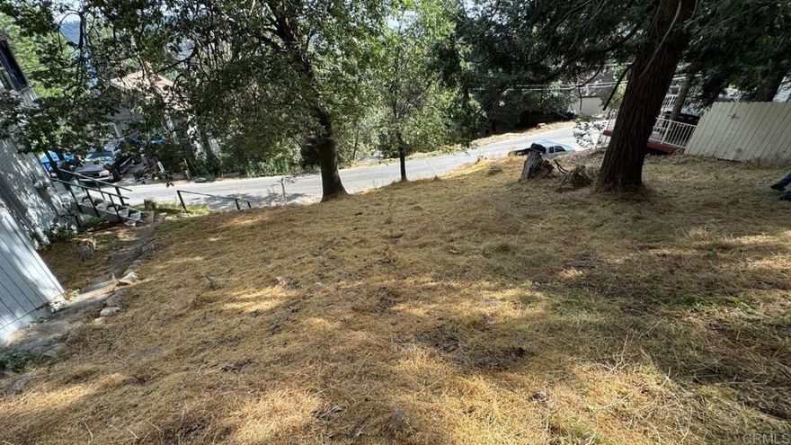 LOT IS APPROX 1.5 MILES FROM LAKE ARROWHEAD AND LK ARROWHEAD SHOPPING AREA. There are homes next to and behind this lot! Great opportunity !!