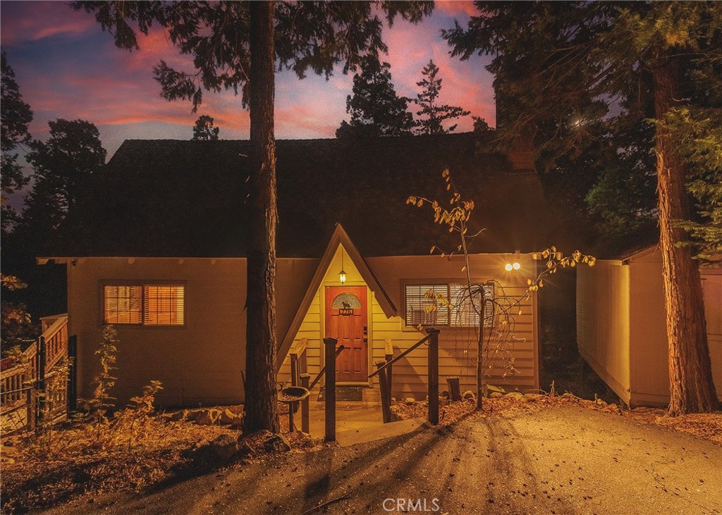 Fantastic 3 bedroom 3 bathroom home located in Lake Arrowhead. There is a bedroom and full bathroom on the mail level with two bedrooms and one full bathroom on the upper level. The bottom floor features a large great room and a full bathroom. The deck is a large area that wraps around the left side of the house offering multiple access points for your convenience. There is one private uncovered parking space available in front of the property. This stunning property offers a great blend of rustic elegance and modern comfort, providing an ideal escape for those seeking tranquility in the San Bernardino Mountains. Situated in a peaceful neighborhood, this home offers breathtaking panoramic views of the surrounding forested landscape and is just minutes from the private Lake Arrowhead Village, renowned for its shopping, dining, and recreational opportunities. With year-round access to outdoor activities such as hiking, boating, and skiing, this location is a nature lover's dream. Enjoy the outdoors on your expansive deck, where you can unwind with a cup of coffee while taking in the serene views of the mountains.