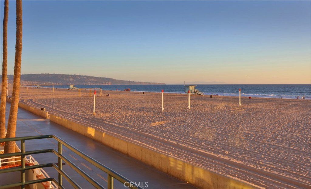 One-of-a-kind custom-built Strand home. Situated on a coveted corner of the North Hermosa Beach Strand. It's ideally located between the Hermosa and Manhattan Beach Piers on a walk street with city-maintained planters creating "Little Lombard Street." The main level features a new European-style kitchen that overlooks the dining and living room with slider doors to the balcony. Upper level features the master suite facing the ocean, with sweeping from Catalina to Malibu. A 2nd bedroom upstairs is filled with light from a custom-designed skylight. Added features are the built-in drawers and shelves, walk-in closets and updated en-suite baths. Lower level has an additional bedroom with full bath located off of a spacious family room with a patio and Strand access, a dry bar and built-in mini-fridge, perfect for entertaining. This level also features an updated powder bath and an office/gym area that could become a 4th bedroom. Parking for up to 4 cars (2 in garage, 1 carport, 1 behind garage doors. Designed by architect Marc Appel, this unique contemporary home was featured in “Hot Properties.” Park your car on Friday night and leave it there! Just step outside your door for a swim, a ride on the bike path and a stroll to dinner along the magical Strand.
