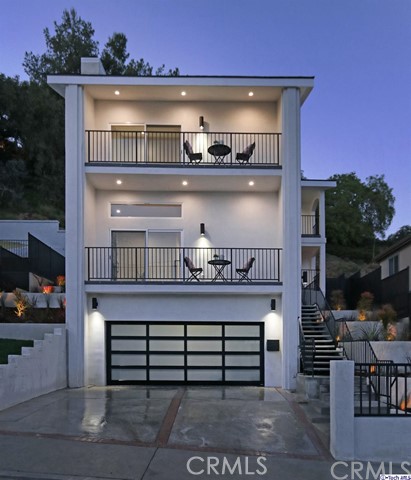 Delight in everything there is to love about Highland Park living! The enviable location & creatively expansive layout of this 4bed/3bath hillside charmer in the red-hot 'North of York' enclave awaits you. Prefaced by a private walkway and terraced landscaping, vibrant double-doors open into a bright, multi-level open concept living room with custom finishes & a dramatic fireplace. Around the corner, sporting quartz countertops & a full array of top-of-the-line, stainless-steel appliances is the spacious & airy chef's kitchen with island overlooking a dining room that any home-chef or entertainer would love to call their own! All four bedrooms enjoy private balconies w/ views! A sultry oversized master retreat also boasts double walk-in-closets & a lavish ensuite bath with double vanity, soaking tub, and chic glass shower. Outback, just off the dining room, an expansive patio has been etched into the NELA hillside, providing a secluded getaway perfect for cocktail & dinner parties into the evening or shaded get togethers under the summer sun. Consistently in any local discussion about the best neighborhoods in LA, Highland Park's trendy shops & exquisite dining choices rival those of booming DTLA just a stone's throw away!