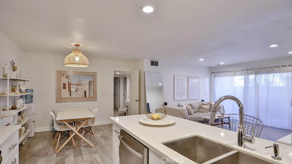 DESCRIPTION
Your new home awaits you at the Woodside Village condominium. This gated community condo is conveniently located just minutes to the popular cosmopolitan area of South Coast Metro, South Coast Plaza, Segerstrom Performing Arts Center, Metro Pointe, OC Mix and a variety of restaurants, shops and easy access to 405, 55, and 73 freeways. The ground level unit features an inviting open concept living, dining, and kitchen layout with clean white modern interior, gray porcelain ceramic tile, and complete recessed LED lighting throughout. The updated kitchen boast floor to ceiling white cabinets, quartz countertop, breakfast bar, and stainless steel appliances. Just outside of the living room, you can enjoy the outdoors or BBQ your favorite meal in your own patio area. All 3 bedrooms are ample sized with built in closets, sliding mirrored doors, crown moldings and polished travertine floors. Low HOA and association amenities; laundry, pool, spa, clubhouse, maintenance, landscaping, water, trash (all included). Other highlights include central A/C unit + furnace, built in shoe closet near the main entrance, detached storage unit, and quick access to the mailbox. One carport parking spot and one assigned parking spot also included. Whether you’re looking to become a first-time homeowner or add another solid rental property to your investment portfolio, this move in ready home could be the one for you! Connect with us today to schedule your private showing.