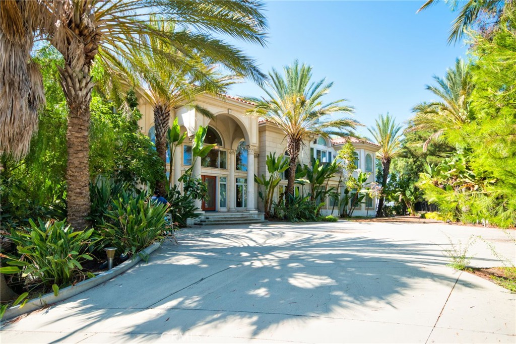 Welcome to this extraordinary estate in the highly sought-after Diamond Bar "The Country" community, offering a rare opportunity to own a magnificent property in a prestigious, 24-hour guard-gated neighborhood. This expansive residence boasts an impressive 11,754 square feet of interior space set on a generous 73,450-square-foot lot, providing both privacy and grandeur.
As you step inside, you'll be captivated by the grandeur of the high-ceiling foyer, elegantly framed by a double spiral staircase and adorned with a stunning crystal chandelier. This estate features 8 spacious en-suite bedrooms, each thoughtfully designed to provide comfort and luxury.
Entertainment is at the forefront of this home's design. Enjoy a private home theater, game room with and a stylish bar perfect for hosting gatherings. Fitness enthusiasts will appreciate the dedicated gym/dance studio, and for relaxation, indulge in the private sauna room. A library offers a quiet retreat for reading or study, while a tea room provides a serene space for moments of tranquility. The home also features a unique spacious wok kitchen, perfect for those who enjoy culinary arts. The Japanese-style tatami room allows you to enjoy a relaxing and delightful oriental moments at any time.
The property's outdoor amenities are equally impressive, featuring a private tennis court and beautifully landscaped gardens. The backyard offers scenic views, creating an idyllic setting for outdoor entertainment and relaxation. The side yard is adorned with fruit trees, providing a lush and fruitful landscape. At the front of the property, an electric iron gate ensures privacy and security.
This three-story residence is conveniently equipped with an elevator, ensuring easy access to all levels. The expansive garage is a car enthusiast's dream, accommodating up to 10 vehicles with ample room for additional storage.
Situated in one of Diamond Bar's most desirable neighborhoods, this property offers convenient access to shopping, dining, and top-rated schools, making it ideal for families seeking both luxury and location. This is a rare find – an exquisite estate that combines elegance, functionality, and unparalleled amenities.
Don’t miss the chance to own this exceptional home. Schedule your private tour today and experience the epitome of luxury living in Diamond Bar.