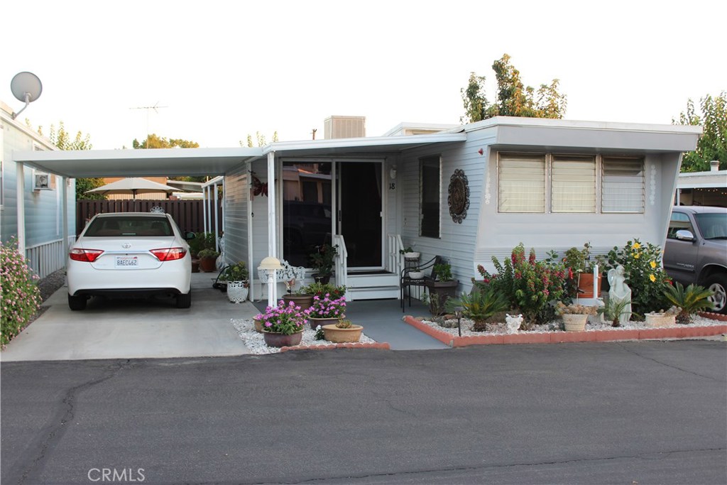 Get your things and move right in. If you're looking for a beautiful home in a beautiful community, we have what you need. You will never grow tired of coming home to this one of a kind home. Newly resurfaced concrete porch and side patio, covered concrete parking area, and separate laundry area under the covered patio. Enjoy a little peace and quiet in the private outdoor sitting area, or just do a little gardening. Come inside of this incredibly well kept coach that looks like it might have been frozen in time. Plenty of room in the living area, nice size kitchen and dining area. Half hall bath has its own vanity closet. Evaporative cooling. Come have a look. You will definitely not be dissapointed.