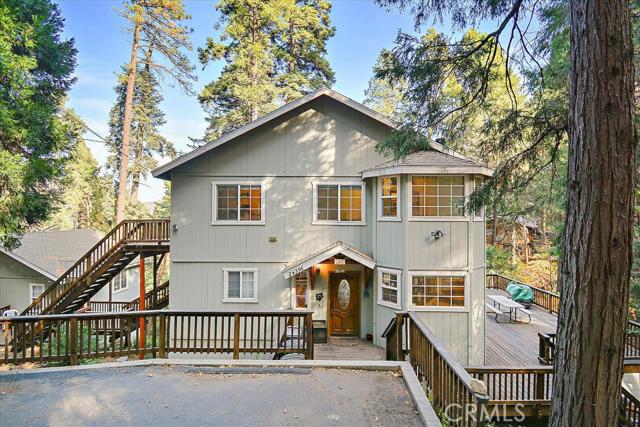 Back-up offers only... Picturesque, secluded home nestled amongst old growth forest. This large, versatile home has beautiful views with a total of 5 bedrooms, 2 in the detached guest house and 3 in the main house. Guest house sleeps 8 comfortably. The main house features an open floor plan with wood beam ceilings, gas fireplace, and spacious island kitchen with walk-in pantry and granite countertops. Upstairs, the master bath has a large jetted tub with a gorgeous view through the huge picture window, his and hers sinks, and a separate shower. 2 separate walk-in closets provide plenty of place for your things. Convenient laundry nook upstairs with high efficiency, front loading washer & dryer included. Game room with foosball, shuffleboard, and full-size pool table, also included in with the home. Huge decks wrap all around the house and total over 1,600 SF. The total property is 2/3 acres across two lots. Fantastic location, very quiet & only 20 min from Lake Arrowhead.