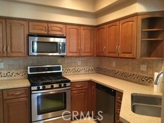 AVAILABLE NOW * Beautiful, gated Viewpointe North * ground level END UNIT with no interior steps and good sized patio * THIS IS FOR THE PICKIEST OF PEOPLE * You will walk in and not want to leave - its that nice. BEAUTIFUL Cherry wood flooring, fresh paint, newer, remodeled kitchen with nice cabinetry, solid surface counters, stainless appliances, baths are also very nice with upgraded fixtures, recessed lighting, newer shower enclosures, new tile in hall bath. Inside laundry area, direct access to 1 car garage, assigned carport space, plenty of guest parking. And it has a longer driveway. GREAT patio which extends from living room to master bedroom - great space for BBQ, patio set, entertaining. This is truly ready to move into today. Close to HOA pool also. Owner prefers no pets and there is a $3000 security deposit.