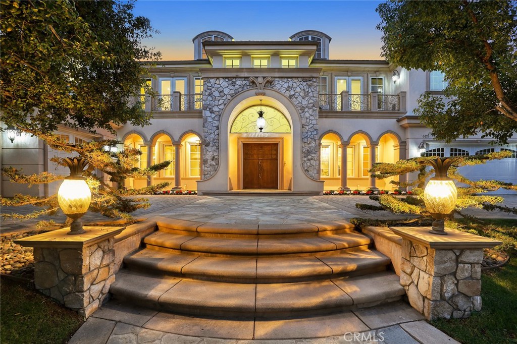 Welcome to Paradise ! This stunning home with panoramic views is nestled on the premier and rarely available north uphill side of Arcadia. Offers a private, gated setting in a 24hrs security gated community. This magnificent estate provides unmatched privacy and seclusion. Originally built in 2005 and masterfully expanded with finest finishes while keeping its pristine charm and character. Spanning approximately 9,594 living square feet. This sophisticated residence is graced by generous high ceilings, recessing lights, high windows throughout. Features huge family room, custom detailed elevator, Gourmet kitchen with top of line stainless appliances, granite countertops with breakfast nook, complete with a dinning room opens to bundle of natural lights and city views. There is an office with stunning views, 2 en-suite guest bedrooms and 2 seprate guests bathrooms down stairs. Master suite boasts his and hers walk in closers, a retreat area and balcony offering fantastic view, Luxurious bath tub with separate shower. transform the hotel like master suites into tranquil breezy retreats. There is also a bonus room on the 3rd floor which can be used as gym room. The fabulous outdoor paradise offers infinity edge pool, resting area, great place for entertaining. This grand contemporary estate is a dream home that brings the best of sleek elegance of modern living.