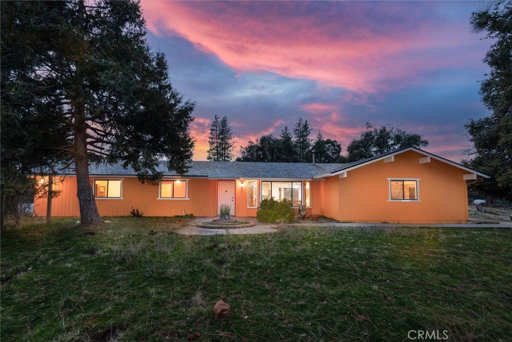 This fantastic Lush Meadows home sits on just over 2 acres with a paved driveway, Mountan views, private well & septic. 3 bed, 2 bath, remodel kitchen with newer appliances, newer flooring, and some newer paint inside. There is an electric fireplace, central heating and AC, two living areas and a dining area. The kitchen is open concept. The slider goes out to a concrete patio in the back for outdoor entertainment. There is a new shed and a bonus out building on a concrete foundation with a sink and power that could be an office, music room, play house and so much more. Flooring and outside paint is less than a year old, roof is under 3 years old and the propane tank is owned. Lush Meadows Estates has hiking trails, horse trails clubhouse, playground, banquet facilities and picnic area. Close to Yosemite National Park and centrally located between Mariposa and Oakhurst! Call your realtor and view this property today!