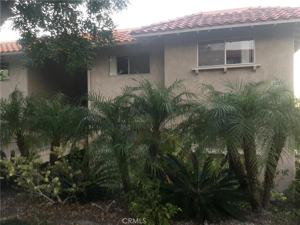 Lovely Upper Castilla End Corner Unit with magnificent views of the Trees and Saddleback Mountains. Large wrap around covered balcony with lovely views to enjoy your morning coffee or evening sunsets. With only 8 steps to enter your new 2 bedroom/ 2 bath home. Spacious living room with a cozy fireplace, dining room and remodeled kitchen with granite counters. Ceramic tile, laminate flooring and new carpet in the master bedroom. Many windows make this home light and bright. Enjoy your full size stack-able washer and dryer. As a Laguna Woods Village resident you will be able to enjoy 7 clubhouses, 5 swimming pools, private community golf courses, tennis courts, lawn bowling greens, shuffleboard courts, craft and hobby workshops, garden centers, game rooms, billiard rooms, gym, horse stables, a very active theater and arts community, and library. Over 250 social clubs to join. This is all within a beautifully landscaped, gate-guarded community convenient to freeways, shopping, restaurants, outstanding medical facilities and of course, the beach.
Condo is located directly across from covered carport parking.