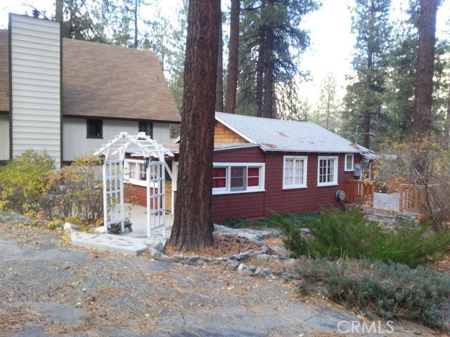 Charm, charm, charm! If a quaint, quiet mountain cabin is what you're looking for, this is it! Great lot and location walking distance to town. New composite deck and large lot to enjoy outdoor living at its best. Other improvements include, new gas wood-stove replica fireplace, new carpet and new windows have been installed in the back porch. An interior wall was removed to open the main space and a new murphy bed installed to accommodate guests. Kitchen is open to living area and utility room is appointed with separate closet for stackable washer/dryer. This cabin has it all for only $135,000.00. Association Amenities: None # of RV Spaces: 0 Special Features: SHNONE Lot Location Type: Standard Location Landscaping: Natural # of Attached Spaces: 0 # of Detached Spaces: 0