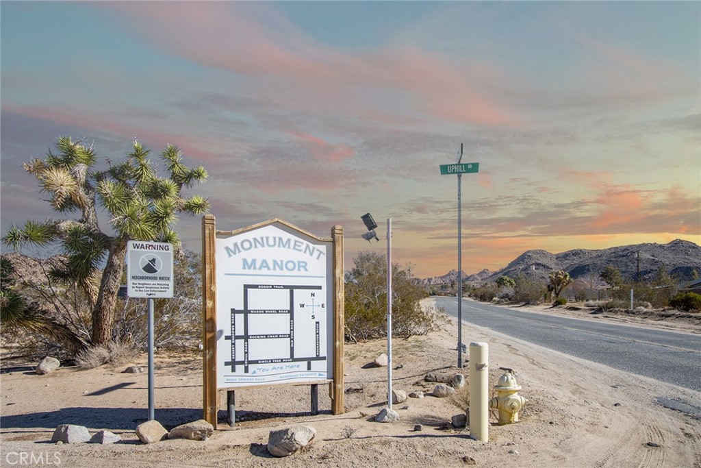 Stargazing Retreat: 2.5-acre parcel in the heart of Monument Manor, Joshua Tree’s most exclusive enclave. Tucked up against the National Park and geologically isolated from the rest of town by encircling rocky mountain ridges at every turn, the Manor provides an unusual peace and serenity not commonly found and sublime views as far as the eye can see. Minutes to the front gate of the National Park, or leave your car at home and hike a short distance down the road and enter the Park by foot for endless hikes. Purchase includes architectural plans for a 2-bedroom, 2-bath 1,716 square foot designer home, with a unique stargazing bedroom with its own private porch; bedroom and porch are elevated 36” above the rest of the house and feature large view windows to take in the surrounding deep wilderness along with a custom 6’x10’ skylight to stargaze while lying in bed at night as you drift off to sleep. Architectural plans are fully approved and stamped by San Bernardino County. An official street address has already been assigned to parcel. Fully-paid water meter included in sale. Located on Uphill Road, the same street on which the well-known Invisible House is located, which was just listed for $18 million. Several accomplished professionals from the music, entertainment and other industries call this area home; between their presence and the proximity to the National Park along with the neighborhood’s unique geology and geography, one assumes that despite correcting market conditions that values will remain more stable in Monument Manor than in other locations, helping to insure your investment.