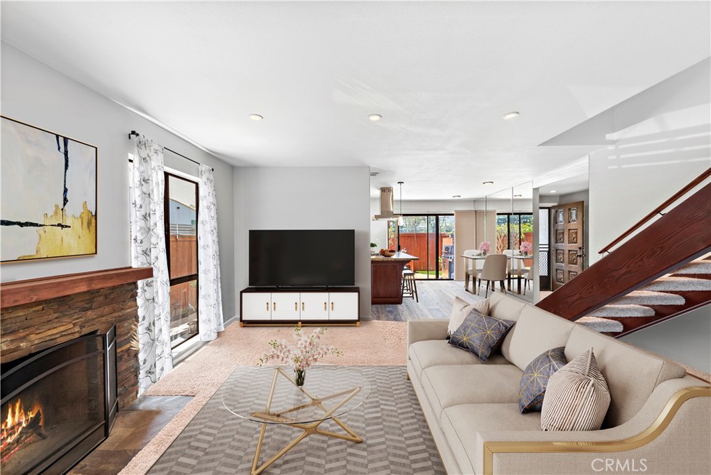 The most meticulously maintained home in the community. The end-unit townhome is located in the absolute best location in the entire community with the front door facing a vibrant green belt and is near the sparkling pool and tennis courts. The home boasts three spacious bedrooms and three bathrooms with an open floor plan that lets in warm, ambient light all year round. The kitchen has been reimagined with granite countertops, gas stove, quality cabinets, and lighting. The upstairs primary and guest bathrooms have been recently renovated and all interior doors and sliders have been upgraded. The large outdoor patio has been expanded and is the perfect sanctuary for morning coffee or to unwind at dusk. The home is finished expansive storage with pull down ladder in attic and garage with a balcony, cozy fireplace, two-car attached garage, newer heating, air conditioning system, water heater, updated switches, outlets, and hardware. Community amenities include two pools, two spas, two clubhouses, two tennis courts, and multiple greenbelts. The community is centrally located to shopping, including South Coast Plaza, dining, freeways, entertainment venues, parks and beaches.