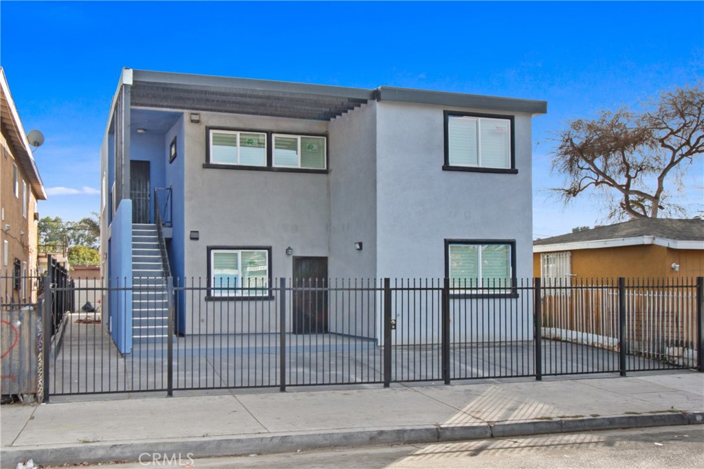 $100K PRICE DROP! Your dream property is now more affordable! Perfect for investment or multi-family living. Don't wait- call me for details or to schedule a tour! Two newly constructed units, comprising of ten bedrooms and four bathrooms, presents a significant investment opportunity for property owners. The 2024 construction incorporates modern features such as solar panels, pre-installed Ring doorbells, and USB and Type-C outlets. Further enhancements include custom gutters, a computerized garage door opener, and barn-style doors. The upper unit features a private balcony with exterior washer/dryer connections and high ceilings. Both units offer desirable open floor plans and granite breakfast bars.
