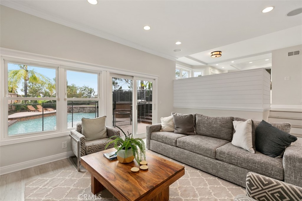 Available September 20th! FURNISHED RENTAL - Beautifully remodeled light and bright home! This stunning 4 bedroom 3 bathroom home has an open floor plan and abundant windows with amazing Canyon Views. It features a Chefs kitchen with granite counters, recessed lighting and high end stainless steel appliances. The entry opens to the living room and dining room spaces. Off the kitchen is a breakfast nook as well as stairs leading down to the family room and one bedroom and full bath. Upstairs are three bedrooms, one of which is a spacious primary suite with an attached sitting room. The primary suite also has a balcony overlooking the backyard and view. The two additional upstairs bedrooms share a full bath off the hallway. Indoor/outdoor living on a large 7800 sqft lot with a swimming pool, spa, water feature, built in BBQ and fire pit, landscaping and gardens. Located in 24 hour gated Rolling Hills with a private 5 acre park with pools, tennis courts, basketball courts, Sand Volleyball Courts and walking/biking trails. This gated community is close to freeways, restaurants, shopping, and beaches. Rates vary based on season $12,000 summer (June, July, August)