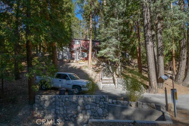Quiet location and neighborhood. Sit on the deck and enjoy the privacy of the forest. You won't be disappointed. Home features vaulted wood ceilings and wood flooring in living room. Wood burning fireplace. Fenced pet area. Pride of ownership. Two bedrooms, one a main with en suite bathroom. Additional bedroom with full bath across the hall.