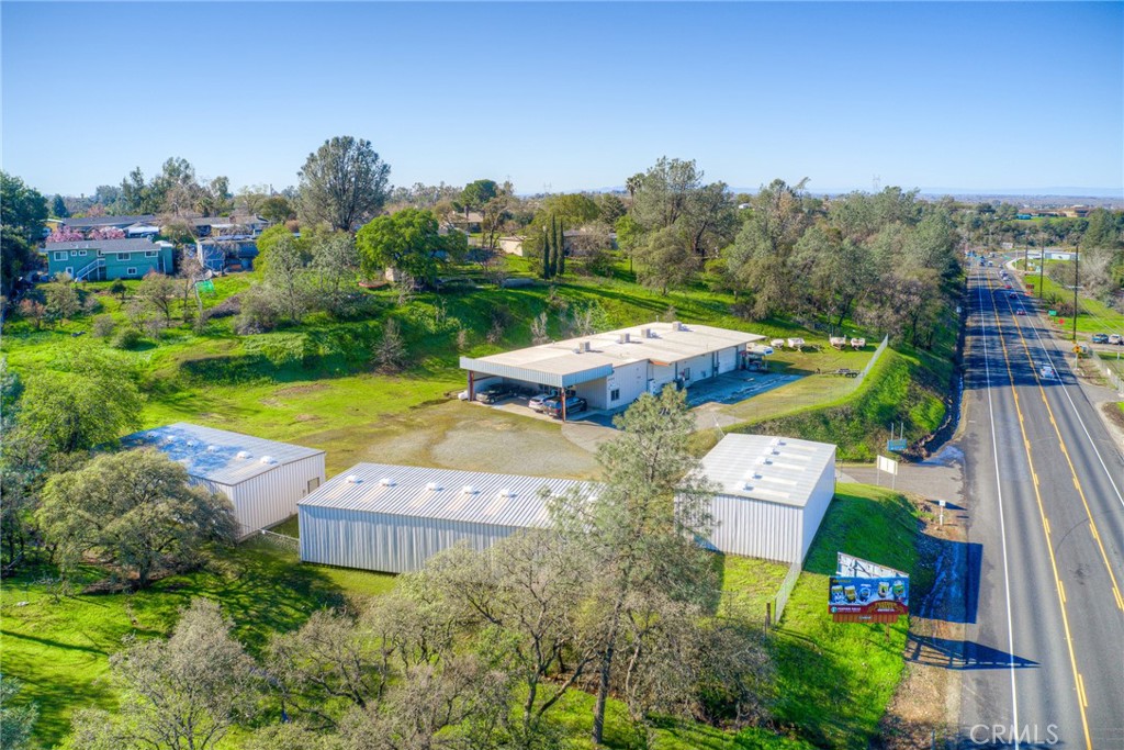 Unlock the potential of this prime commercial property located just minutes from Lake Oroville and downtown. This property features 17 storage units, 1-20'x30' and 16-10'x30', all units 14' high. Perfect for potential of extra income with a variety of business needs, along with a large 5000 sq.ft. shop and retail area ideal for manufacturing, repairs, or other commercial activities. The spacious layout offers flexibility and ample room to grow your business. Don't miss this opportunity to invest in a strategically located property with great potential. Contact us today for more information!