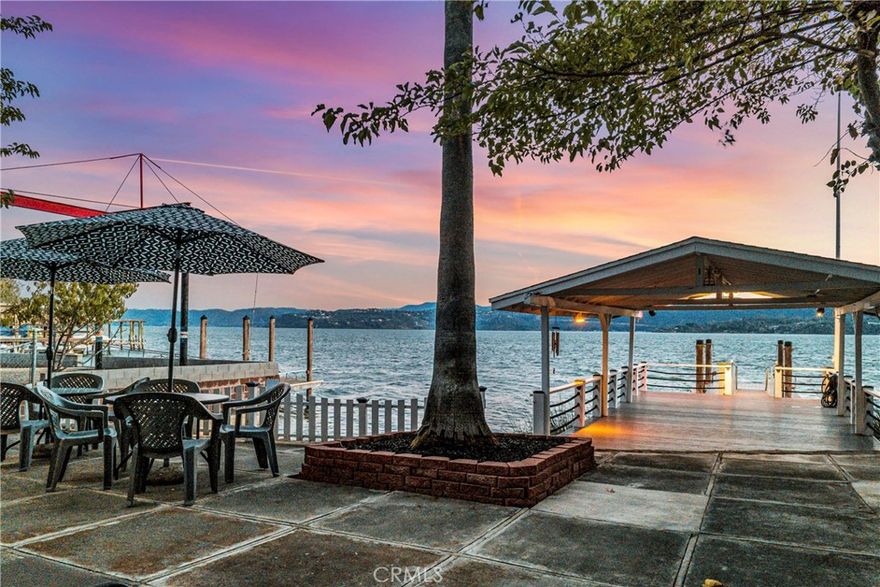 Incredible Mt. Konocti views on this nearly 1/2 acre Lakefront property with 58' of lake frontage + private boat launch & dock!! 2 bedrooms with peaceful views & 2 full bathrooms with 1,344 square feet of living space. A sleeping cottage with 1/2 bath, workshop, garden shed, 2 large carports and extensive parking opportunities for vehicles, RV, boats & more! Enter the single level home to find upgraded luxury vinyl plank flooring + baseboards, fresh interior paint, crown molding & light fixtures throughout. The galley style kitchen has new countertops, tile backsplash and freshly painted cabinets offering a modern feel. Updated appliances including an oven, propane cooktop, dishwasher, microwave & refrigerator. The open concept living room offers breathtaking lake and mountain views with built-in book shelving for storage or a place to display your decor. Dining room off the kitchen offers a great space to host guests. The primary suite with ensuite full bath is sure to please. Need parking? 3-car carport off the main home, 3 spaces in front of the home + extra parking near the detached 18x16 workshop with an attached 10x20 carport. Expansive storage space under the home is ideal for all the lake floats or towables. 6x3 tool shed is a bonus! The 12x14 cottage offers a place for guests to stay with a studio style room + 1/2 bath. 2 pump houses with sand filters for plentiful water, pumped directly from the lake! This property shows pride of ownership and has been impeccably maintained! The roof for the home, cottage & shop, all have recently been replaced as well as the evaporative cooler & water heater in the main home. The backyard was landscaped with privacy in mind! Large trees line the property protecting your oasis from wind and neighbors. The lakeside patio is an incredible place to entertain and soak up the beautiful surrounding. Watch the herons and other wildlife from the covered over-water patio area with adjoining gangway and boat dock. The private boat launch offers easy lake access with your Boat, Jet Ski, SUP or Kayak. This coveted location on the lake provides easy access by watercraft to nearby attractions such as Konocti Harbor Resort or Richmond Park. Ideal for a lake retreat, vacation rental, main home or investment property- you decide! Clearlake is known for some of the best bass fishing and located only 2.5 hours from the Bay area, this is truly a one of a kind, must see lakefront estate!