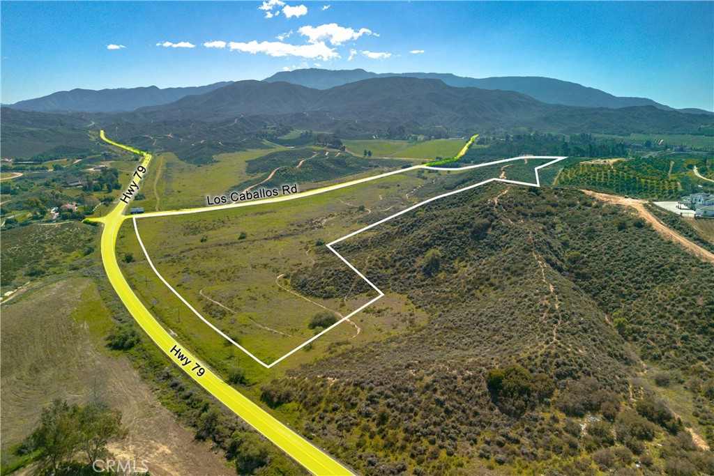 EXCLUSIVE OPPORTUNITY for developers, investors and builders to acquire an expansive 34.5 acre parcel. This property is strategically positioned at the intersection of State Highway 79-South and Los Caballos Road, which offers prime visibility and accessibility, making it an ideal canvas for a variety of uses. For example, the property is zoned Wine-County Wine (WC-W) with zoning approval as a Class V Winery which allows wineries, tasting rooms, vineyards and upscale hospitality offerings. Situated across from the renowned Galway Downs, this is an opportunity you don't want to miss!!!