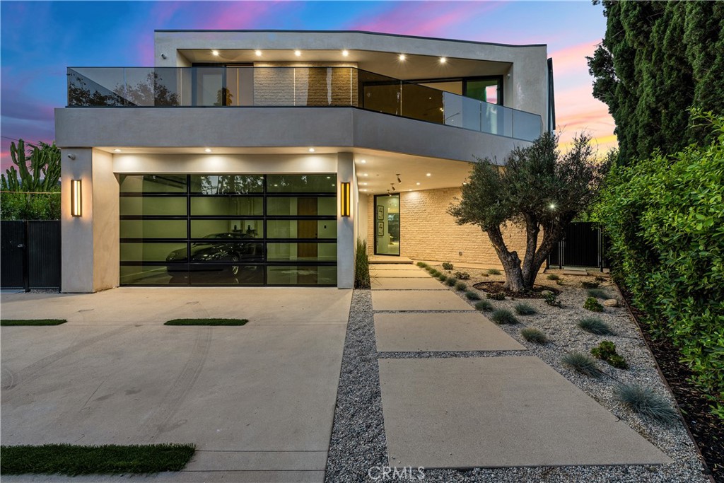 Welcome to your captivating new construction modern masterpiece with incredible views, located South of the Blvd in Encino. Located on a flag lot set behind large private gates, sits this grand estate perched above boasting approx. 7,977 sqft of refined luxury. Awe inspiring main level welcomes you to quintessential indoor outdoor California living. Incredibly open floor plan generates a smooth flow from the sweeping through the dining room to with glass enclosed wine display, family room with stone fireplace, chef’s kitchen with large center island, walk in pantry pantry, bedroom with en-suite bathroom, Media room and patio overlooking the ultimate entertainer's dream backyard. Upstairs beholds an upstairs living room complete with fireplace, 3 exquisitely designed en-suite bedrooms perfect for family and friends. The romantic master retreat features a stunning fireplace, expansive walk-in closet, luxurious spa-like bathroom, and glass sliding doors leading out to the extensive balcony with incredible views. The entertainers backyard showcases a covered patio deck with outdoor fireplace, outdoor kitchen, dedicated gym area under the pool, and large pool and spa with infinity edge. Additional conveniences include Control4 smart home automation system and high tech security. Architecturally designed with meticulous perfection, this trophy estate is unlike any other. Close to the best shops, fine dining and many more.