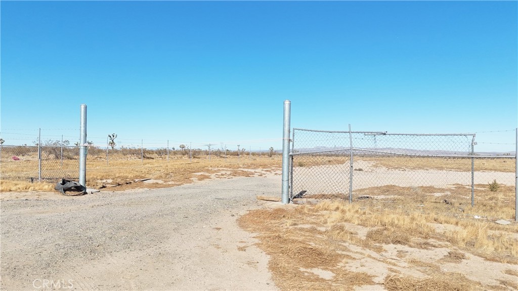 Approximately 20 acres of residential land north of Palmdale Road/Highway 18. Perfect for someone looking for a large residential parcel. Power and water are believed to be at Camellia Road. A water line extension would be required. The approximately 20 acres just north of this lot is available as well as the two lots south of this on Palmdale Road/Highway 18. There are Joshua trees on this lot. Buyer and Buyer's Agent to verify all information. Parcel 5.