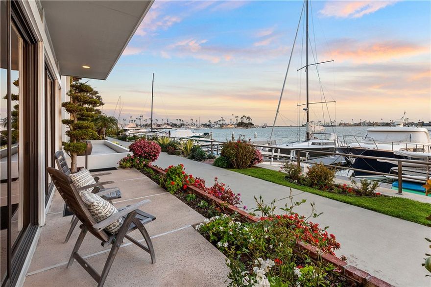 Enjoy Spectacular Panoramic views of Picturesque Alamitos Bay from this Captivating Waterfront Residence located in a Premier location on the highly coveted “Gold Coast” of Naples Island. Built in 1977 & still owned by the original family, this Charismatic 3 Bedroom 2.5 Bath home perfectly blends the classic lines of Mid-Century Modern Architecture, with the Warmth & Charm of a Cape Cod Beach Cottage, in an expansive floor plan featuring an elevator & a large Boat Slip right out front.   A Dramatic two story foyer welcomes by way of an impressive split staircase, framed by a wall of windows, for amazing natural light as you head towards a cozy office overlooking the sweeping Dining & Living Rooms accented by beamed ceilings, an inviting fireplace and the front terrace with views that go on forever. The well equipped kitchen, featuring custom cabinetry, stainless steel appliances & granite counters with a breakfast bar also looks out to the mesmerizing views shared by the entire main floor. Upstairs, two generously sized bedrooms with ample closet space share a full bath adjacent a big laundry room at the back of the house. Bayside, a spacious landing and bonus room (library, work out room?) precede a double door entry to the alluring Primary Retreat with sitting area, huge walk in closet, a sumptuous spa-like bath with separate soaking tub & shower, and a delightful balcony to soak up the sensational, unobstructed views, views, views! Other noteworthy features include a 2 car garage with separate covered parking pad, central heat & air conditioning and outstanding walkability to the Long Beach Yacht Club, trendy shopping & dining at 2nd & PCH, Belmont Shore, and all this special waterfront community has to offer. BE SURE TO CHECK OUT THE VIRTUAL TOUR!